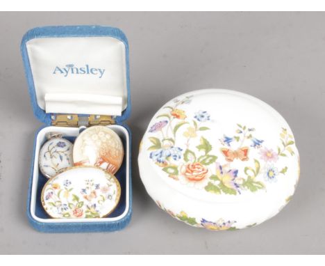A Small Aynsley Lidded Ceramic Trinket Dish, together with Three Brooches.  