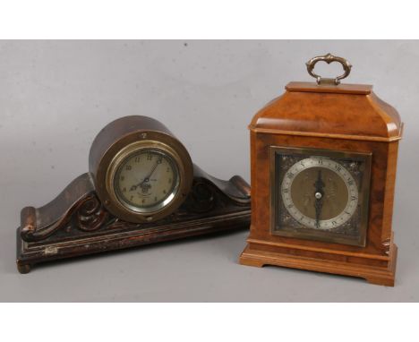 Two vintage clocks. Includes Smiths car dashboard example mounted in carved oak case and a burr walnut cased Elliott example.