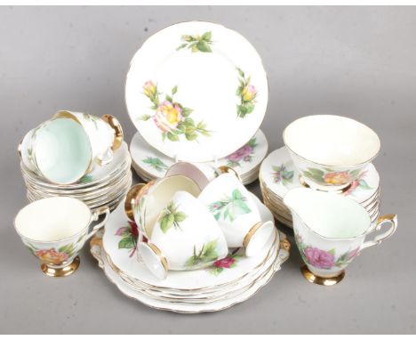 A Harry Wheatcroft 'Paragon' Part Tea Service. Includes Teacups and Saucers, Side Plates and Sugar Bowl.  