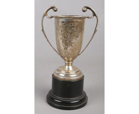 A miniature silver cup on stand, replica of The Sheffield Daily Telegraph Challenge Cup. Awarded to R Mace. Assayed Birmingha