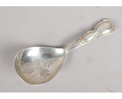 A Victorian silver caddy spoon. Assayed Birmingham 1882 by Hillard &amp; Thompson.  