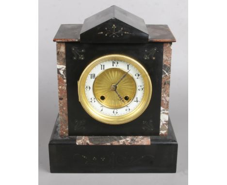 A Black Slate and Marble Mantel Clock with 'The Britannia Movement'. Height 27cm.  Condition Fair, Clock not Running.