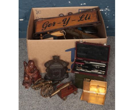 A Box of Miscellaneous. To include Two Brass Desk Cannons, A Compass Set, A Group of Cigarette Cards and a Small Collection o