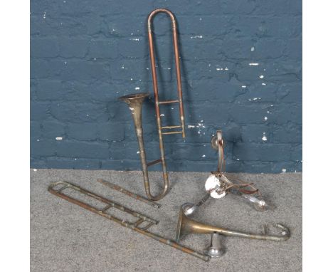 A group of trumpets &amp; an art deco light fitting.  