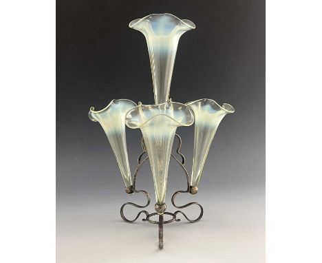 An Arts and Crafts straw opal glass and silver plated epergne, probably James Powell and Sons, circa 1890, the sinuous serpen