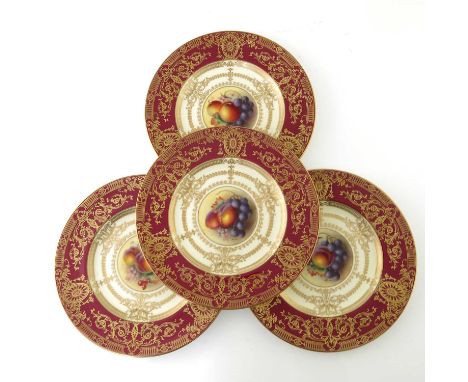 W Bee for Royal Worcester, a set of four fruit painted plates, decorated with apples, plums, berries and grapes within a red 