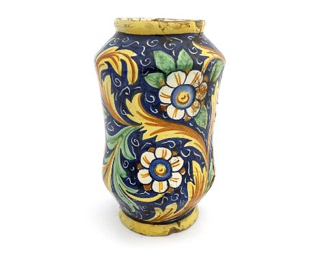 An Italian Maiolica albarello pharmacy jar, probably 17th century, waisted shouldered form, polychrome decorated with foliate