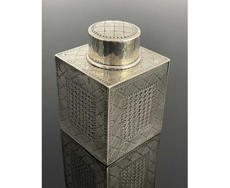 Bernard Cuzner for Liberty and Co., an Arts and Crafts silver tea caddy, Birmingham 1911, cuboid form, incised with diaper fr