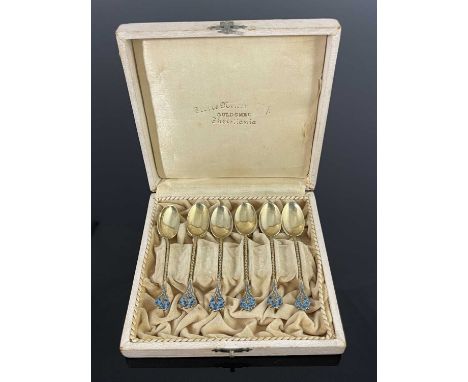 A set of six American Art Nouveau silver gilt and enamelled tea spoons, Gorham, model 808, circa 1900, cast with forget me no