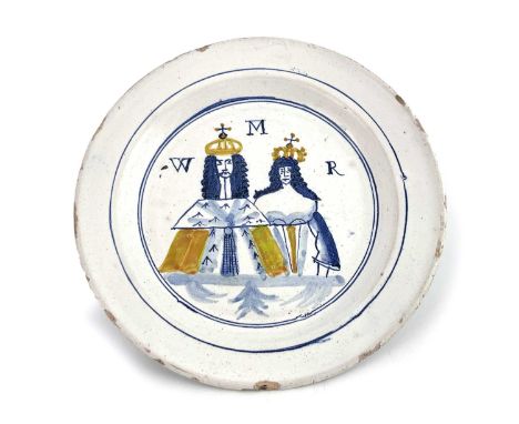 A William and Mary Delft commemorative plate, circa 1680, polychrome decorated with a double portrait of the crowned king and