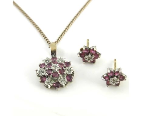Ruby and diamond cluster pendant and matching stud earrings, flower form pendant set with seven illusion set diamonds and 12 