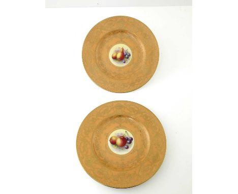 H Ayrtonfor Royal Worcester, a pair of fruit painted plates, decorated with pears, damsons, apples and cherries, within a pea