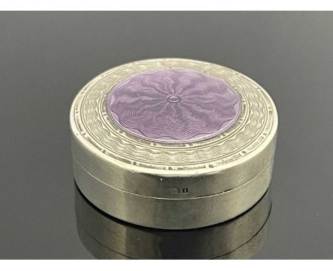 Liberty and Co., a silver and enamelled pill box, Birmingham 1908, circular form, the hinged lid with purple guilloche enamel