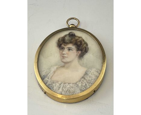 An Edwardian portrait miniature, oval bust length of a woman in lace trimmed dress, brown hair, 7cm x 5.5cm, gilt frame Ivory