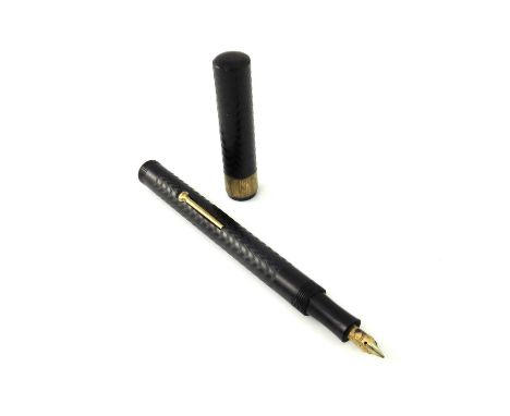 A Brittanic fountain pen, engine turned black barrel and screw posting cap, lever filler warranted 14 carat gold nib, 13.5cm 
