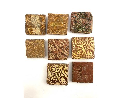 A collection of Medieval encaustic floor tile, 14th century and later, including various Gothic foliate designs, fleur de lys