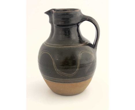 Eddie Hopkins for Winchcombe Pottery, a large studio pottery jug, ovoid stoneware, green glaze with sgraffito wave banding, i