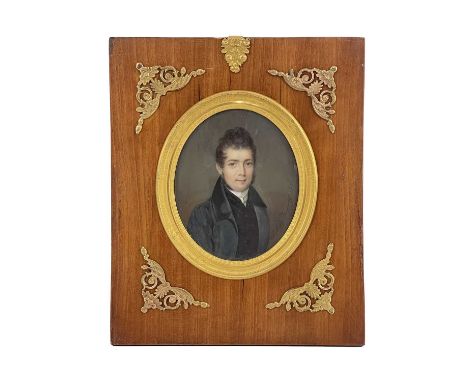 Julia Dagoty, a 19th century portrait miniature, half length oval depicting a gentleman in blue grey coat, signed and dated 1