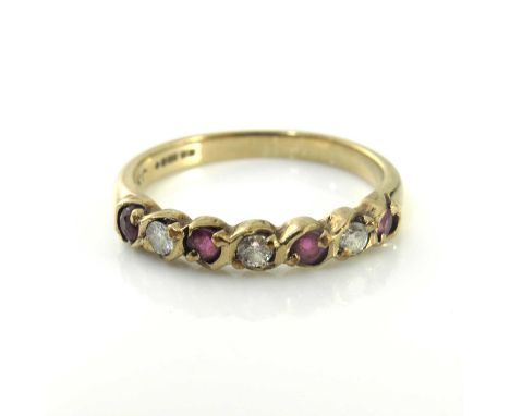 18ct gold half eternity ruby and diamond ring,the band set with four facet cut rubies and three diamonds, size K