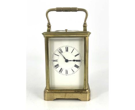 Jacot, Paris, a repeating carriage clock, early 20th Century, gilt metal corniche case with swing handle, visible escapement,