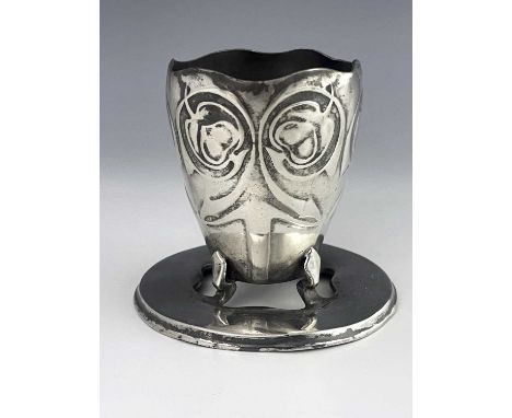 Archibald Knox for Liberty and Co., a Tudric Arts and Crafts pewter vase, model 0512, the beaker form vessel with serpentine 