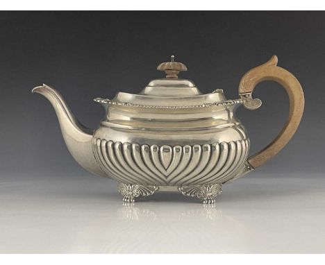 An Edwardian silver teapot, William Hutton and Sons, London 1905, half reeded rectangular section shouldered boat form, gadro