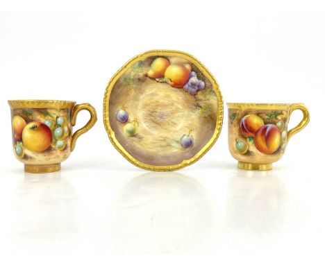 Frank Roberts for Royal Worcester, two fruit painted coffee cups, circa 1960, C scroll handles and crimped gilded rim, decora