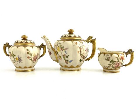 A Royal Worcester blush ivory three-piece tea set, circa 1890, including teapot and cover, milk jug and twin handled sugar bo