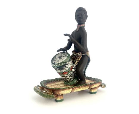 Petros Gumbi for Ardmore Pottery, a studio pottery sculpture, man playing bongo drum, painted by Siyabonga Mabaso, painted ma