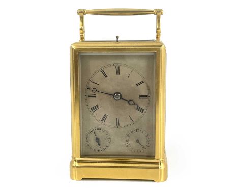 A French repeating carriage alarm clock, late 19th/early 20th Century, gilt metal corniche case with swing handle, visible es