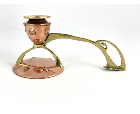 A Jugendstil copper and brass chamber stick, probably Carl Deffner, the urn form sconce embossed with diamond motifs, support