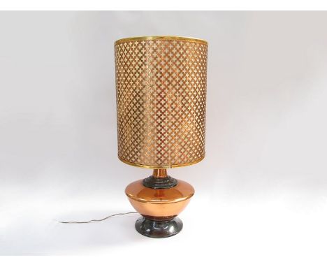 A 1970's copper table lamp with lattice form cylindrical shade, squat form made by Copper Craft, Zambia 