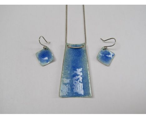A 1980's silver and powder blue enamel shield pendant with hammered reverse, on silver chain, marked 925 and matching earring