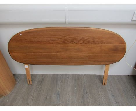 An Ercol double bed headboard 