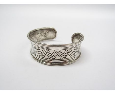 A mid to late 20th Century sterling silver bangle with Zig Zag engraving , marked 925 