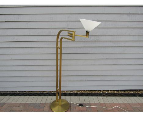 A mid 20th Century brassed standard lamp with white glass conical shade on adjustable arm.  Label for Reggiani Goffredo, Ital