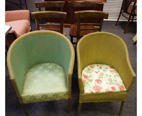 A Lloyd Loom style tub chair; a Lloyd Loom style commode chair; four dining chairs. (6)