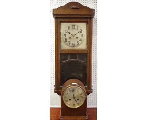 An oak wall clock, c.1930; an oak 8 day mantle clock. 