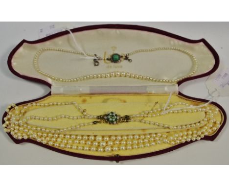 A Three String graduating pearl necklace, 9ct gold clasp in the form of a flower, set with emerald and opal stones, another s