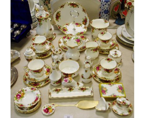 A Royal Albert Country Rose part tea service for four, including teapot, teacups, saucers, tea plates, cake stand, etc, other