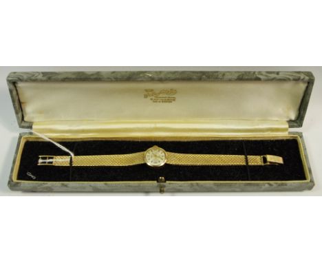 A 9ct gold lady's verity watch, integral strap, 17 ruby incablock movement, gross weight 21.1g.  
