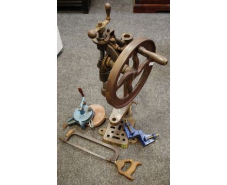 A vintage hand wound pillar drill; a hand wound bench grinder; a Record No.140 mitre clamp; a hacksaw. (4)