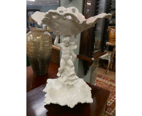 White ceramic centrepiece depicting cherub and dolphin - Approx height 57cm 