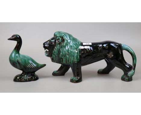 Large glazed ceramic lion and duck figure - Approx height 22cm Length of lion approx 43cm 