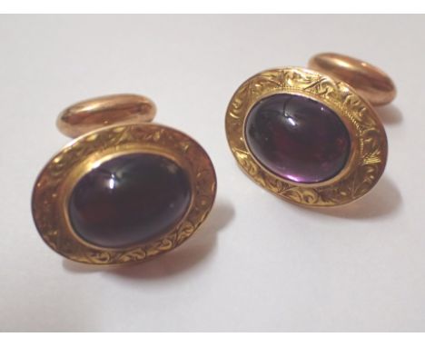 Pair of gents 14ct yellow gold cufflinks set with amethyst coloured jewels 6.2g