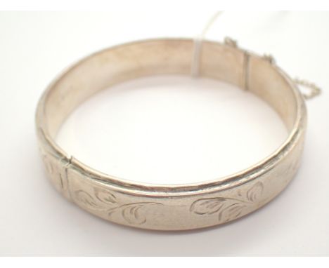 Hallmarked silver bangle with safety chain and inscription to interior