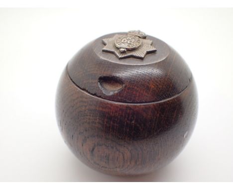 Wooden inkwell with Dragoon Guards badge CONDITION REPORT: Few minor scuffs and surface scratching. Ceramic inner well is cra