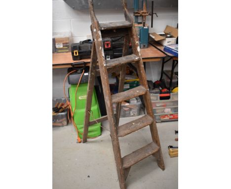 A set of vintage wooden step ladders
