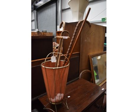A vintage umbrella stand, in the Mathieu Mategot style