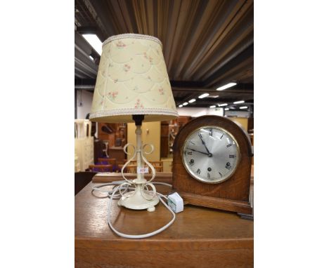 An early 20th Century oak cased mantel clock and a painted metal table lamp